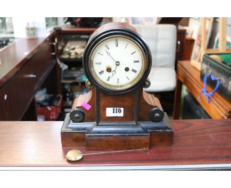 Victorian enamel faced Roman pillar mantel clock with scroll supports. 27cm in Height 