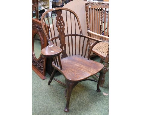 19thC Elm Windsor Elbow chair with Stick and wheel pierced back over rail and carved seat and pad feet 