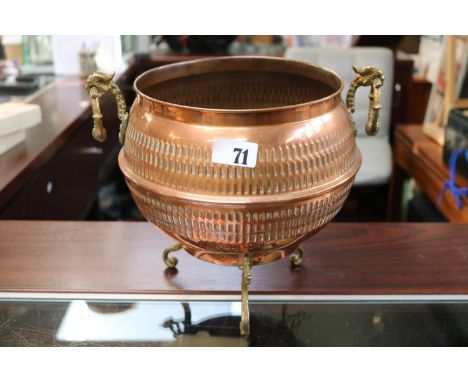 Copper Hammered Urn planter with Brass Griffin handles over scroll brass feet. 26cm in Height 