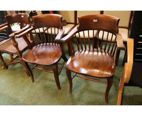 Pair of 19thC Oak Elbow chairs Elbow chairs with stick back and carved shaped seats over shaped legs and stretchers 