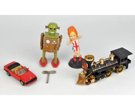 A selection of die cast and tin plate models, including robot and two tin plate cars.