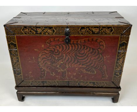 TIBETAN TRUNK ON STAND, 101cm W x 80cm H x 49cm D red, orange, black and gold lacquer with a rectangular rising top and a myt