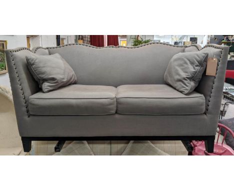 SOFA, two seater, contemporary, grey upholstered, studded frame, with two loose back cushions, shaped back, 74cm H x 166cm W 