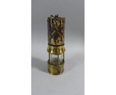 A Brass Miner's Safety Lamp by Richard Johnston, Clapham and Morris Ltd Manchester, no.327, 23cm High 