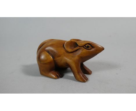 A Carved Wooden Netsuke in the form of a Mouse, Signed to Base, 6cm wide x 3cm high 