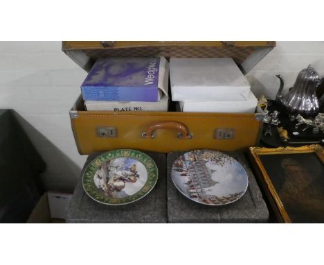 A Vintage Suitcase Containing Various Decorated Plates 