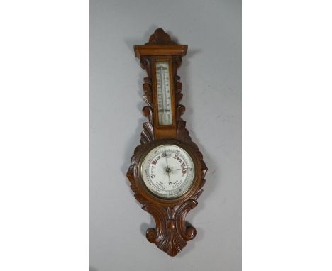 A Late Victorian Oak Framed Wall Hanging Aneroid Wheel Barometer with Temperature Scale, 54cm High 