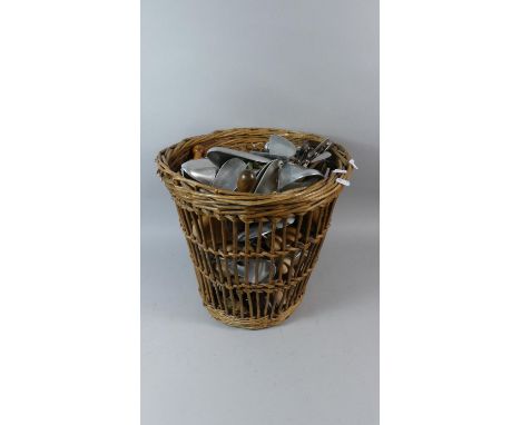 A Vintage Wicker Waste Bin Containing Shoe Trees 