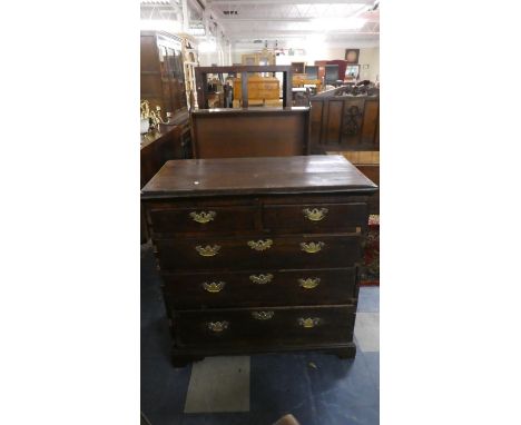 A Georgian Oak Chest of Two Short and Three Graduated Long Drawers with Brass Drop Handles, Crossbanded Top and Bracket Feet 