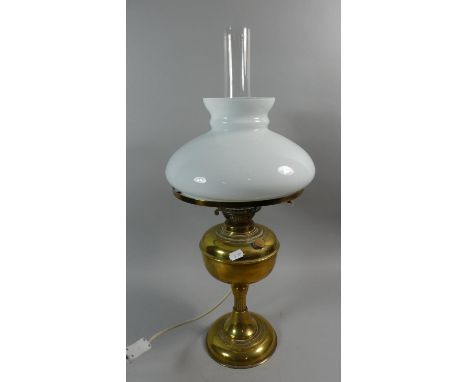 A Brass Mounted Table Lamp in the Form of an Oil Lamp with Opaque Shade and Chimney 