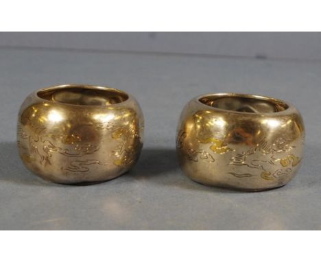 Pair Chinese silver napkin rings Engraved decoration. Monogrammed.  Character marks to interior. Some dents to surfaces. W68g