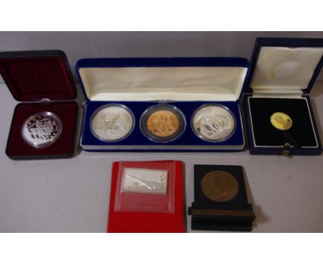 Cased Canadian 1994 proof silver dollar coin together with a Concorde silver stamp medallion, 2 Chinese 1 oz silver Panda coi