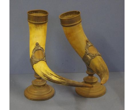 Pair of vintage decorative mounted horns with cast metal surrounds, 34cm high (tallest)