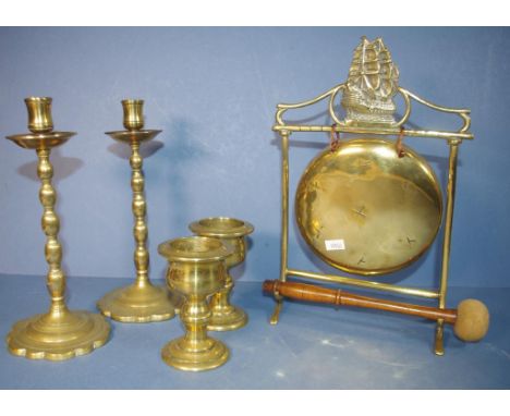 Vintage brass dinner gong 29cm high approx., together with 2 pairs of brass candle sticks
