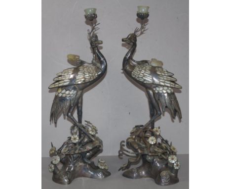 Pair of Oriental silver stalk candlesticks with inlaid mother of pearl, jade, and semi precious stones, H49cm approx, tested 