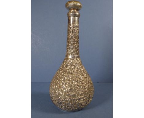 Chinese silver cased glass decanter encased peony blossom decoration. Collar of decanter dented & stopper as inspected. H26cm