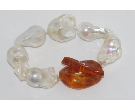 Baroque pearl bracelet with an amber toggle clasp