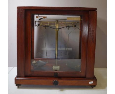 Wood and glass cased laboratory scales makers W & J George & Becker Ltd., London & Birmingham. Together with 4 brass weights.