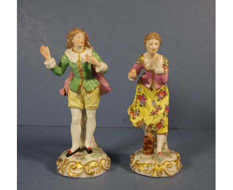 Pair French porcelain figures Woman Playing Boule; & Gentleman in Blue Cape. Both marked "Made n France" to base. H18cms appr