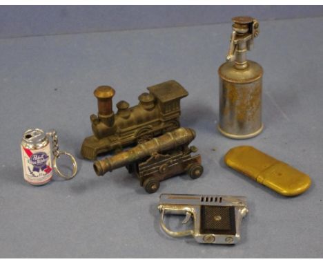 Five vintage novelty cigarette lighters together with a novelty pencil sharpener