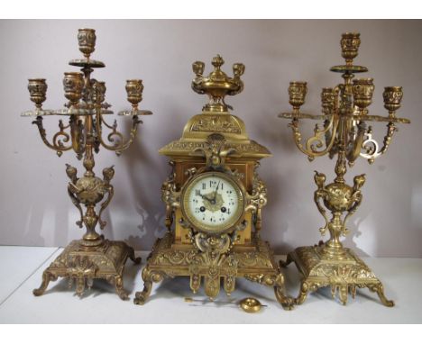 Japy freres (France) brass clock garniture with 8 day strking movement (bell) in ornate decorated case with two 4 branch cand