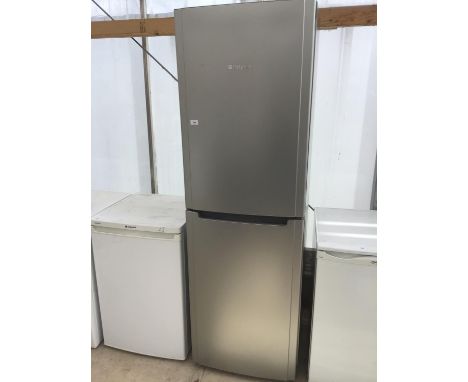 A SILVER HOTPOINT FRIDGE FREEZER IN WORKING ORDER 