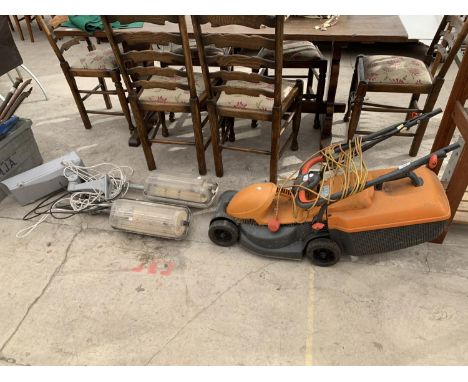 A FLYMO RE320 LAWNMOWER IN WORKING ORDER, TWO OUTSIDE LIGHTS AND A SECURITY CAMERA 