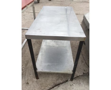 A STAINLESS STEEL TABLE WITH LOWER SHELF 