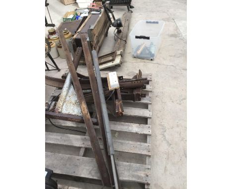 A HEAVY METAL FRAMED STAND WITH AN ANGLE POISE BENCH LIGHT AND A LOCKABLE TOOL BOX 