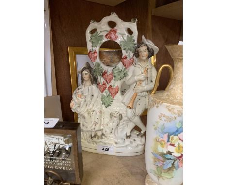 A STAFFORDSHIRE CERAMIC FIGURE POCKET WATCH STAND 