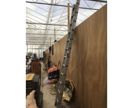 A TWO SECTION TWENTY FOUR RUNG ALUMINIUM LADDER 
