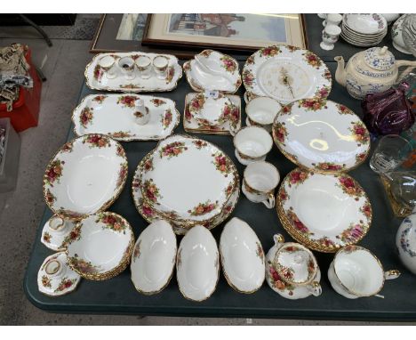A COLLECTION OF ROYAL ALBERT OLD COUNTRY ROSES CHINA TO INCLUDE CLOCK, PLATES, BOWLS, CUPS, CANDLE STICKS ETC 