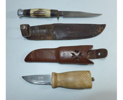 A HELLE NYING KNIFE AND SCABBARD AND A SCOUT KNIFE (2) 