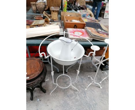 A VINTAGE ENAMEL WASH BOWL AND JUG ON METAL STAND 