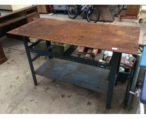 A METAL WORK BENCH WITH LOWER SHELF 