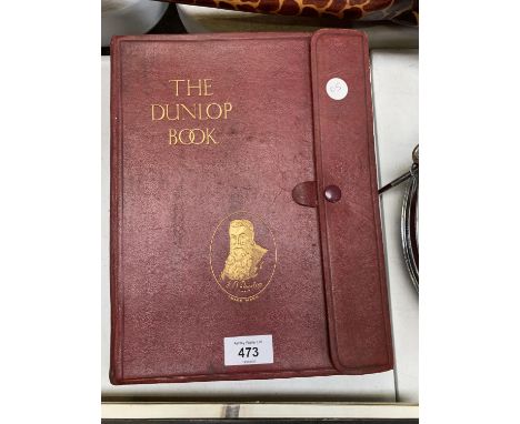 A 'THE DUNLOP BOOK' IN LEATHER EFFECT BINDING 
