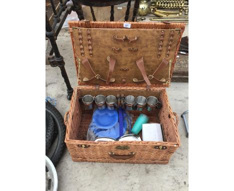 A SHIRE GREEN PICNIC BASKET WITH METAL CUPS. ORNATE WINE STOPPERS CAMPING PANS ETC 