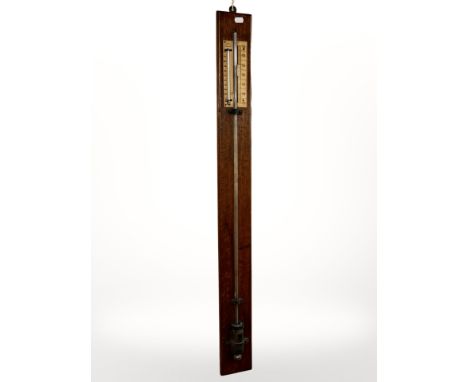 An oak stick barometer by Davis of Leeds, length 106cm.