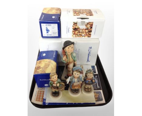 A Goebel limited edition figure of a boy carrying an umbrella, number 61 of 200 and three further Goebel boys, all boxed 