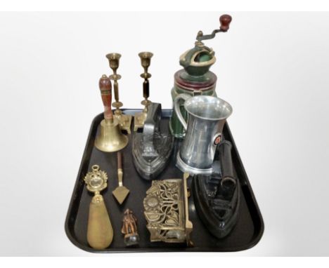 A cast iron and ceramic coffee grinder, a pair of brass candlesticks, shoe horn, two irons, tankard etc 