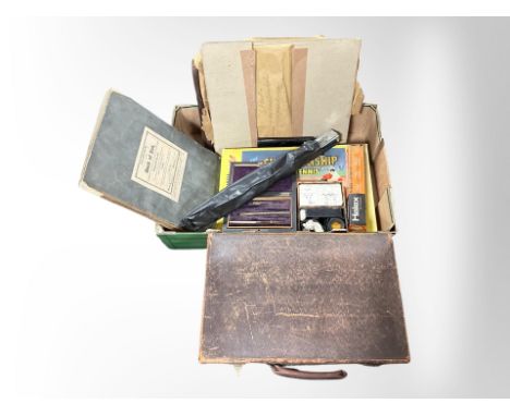 A vintage briefcase and a further box containing vintage championship table tennis game, a book of illustrations from the Boo