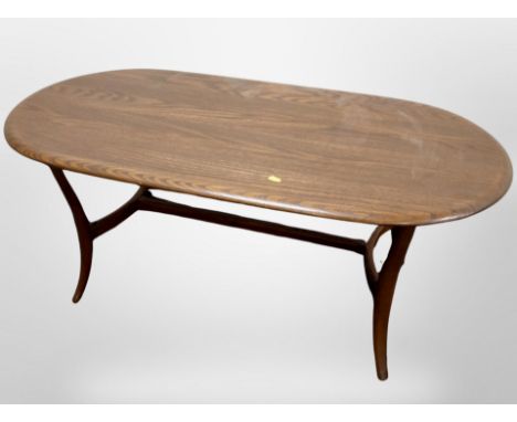 An Ercol oval coffee table, 115cm x 59cm 47cm.