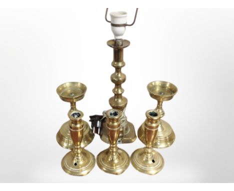 A brass candlestick converted to a tablelamp (continental plug), together with a pair of pricket candlesticks and a further s