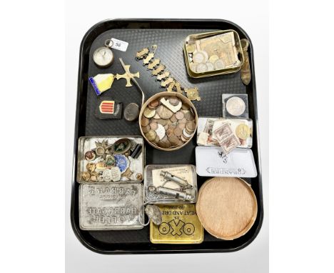 A collection of coins, badges, antique compass, bookmark, A R P and Acme whistles, etc.