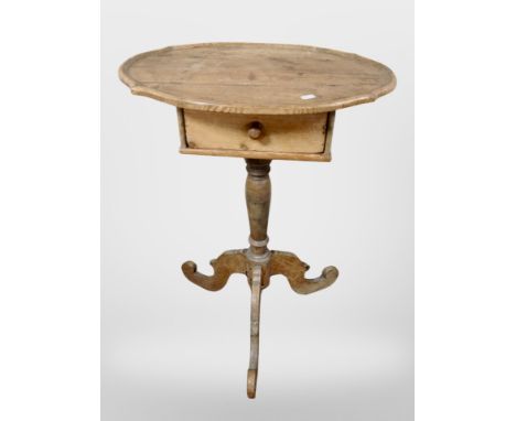 An early 19th-century pine oval tripod occasional table fitted with drawer, 54cm x 37cm x 75cm.