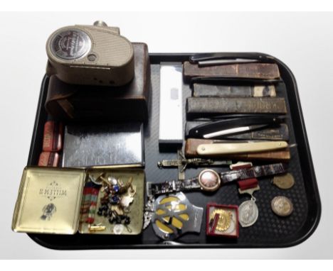 A group of antique cut-throat razors, AA badge, medals, crucifix, cigarette case, Bell & Howell model 605 camera 