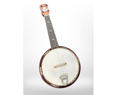 A four-string banjo ukelele.