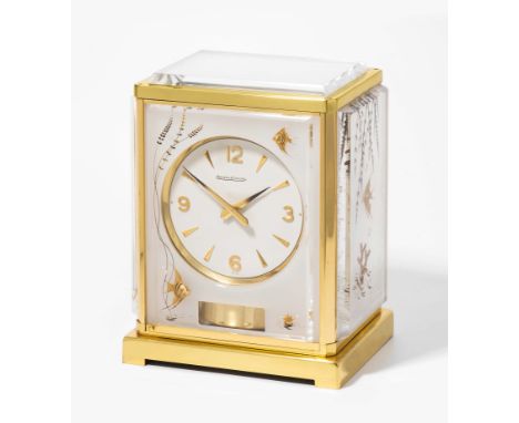 Tischuhr "Atmos"Jaeger-LeCoultre. Modell "Marina". Um 1970. Vergoldetes Messingehäuse. Allseitig facettierte Plexiglasplatten