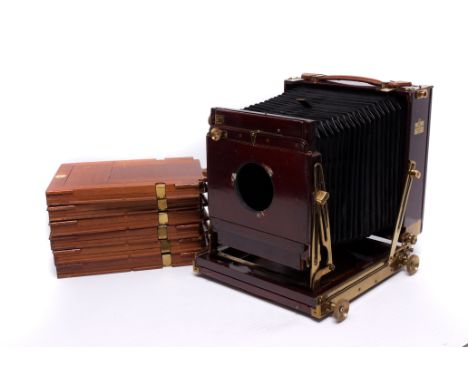 A Thornton Pickard Royal Ruby Triple Extension Mahogany Field Camera, lacking lens, with give DDS, in maker's case