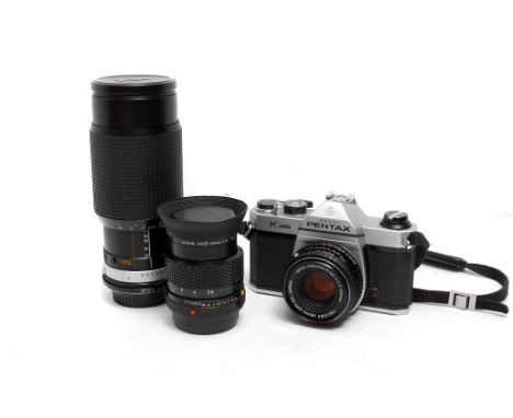 A Pentax K1000 SLR Camera, with various lenses including Pentax-M f/1.7 50mm and others (a lot)